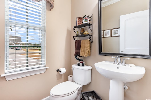 bathroom with toilet and sink