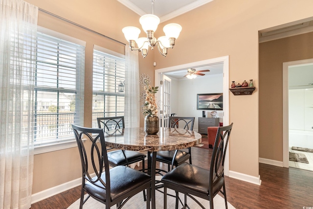 dining space with crown molding, dark hardwood / wood-style flooring, and ceiling fan with notable chandelier