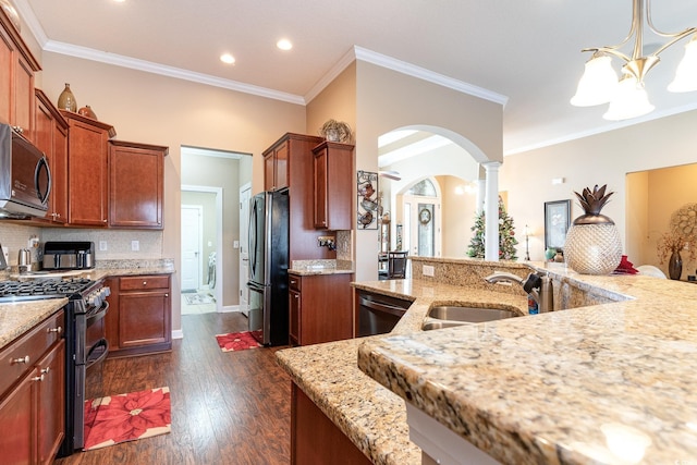 kitchen with sink, dark hardwood / wood-style flooring, a notable chandelier, crown molding, and appliances with stainless steel finishes