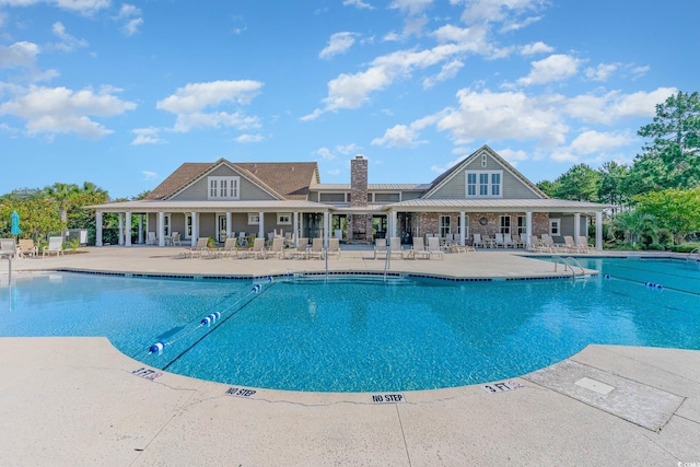 view of pool featuring a patio