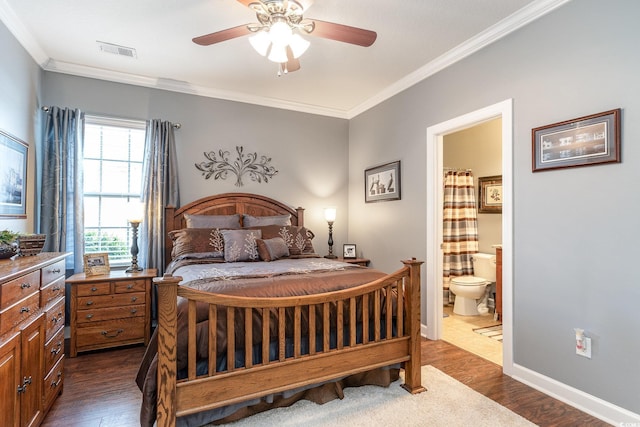 bedroom with connected bathroom, dark hardwood / wood-style floors, ceiling fan, and ornamental molding