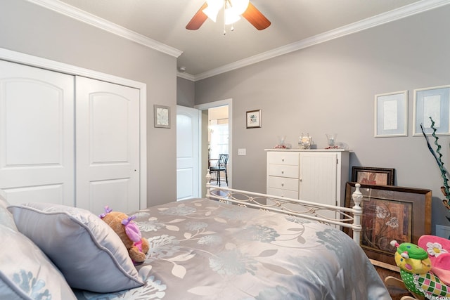 bedroom with a closet, ceiling fan, and crown molding