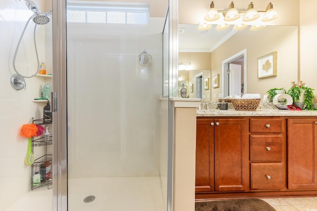 bathroom featuring vanity, a shower with door, and crown molding