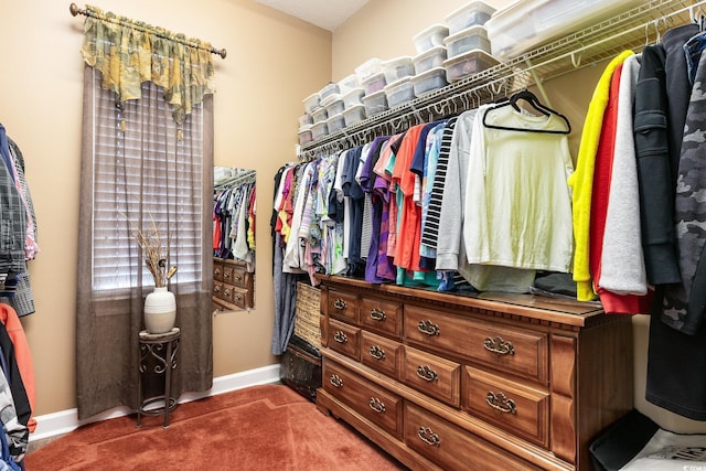 spacious closet featuring dark carpet