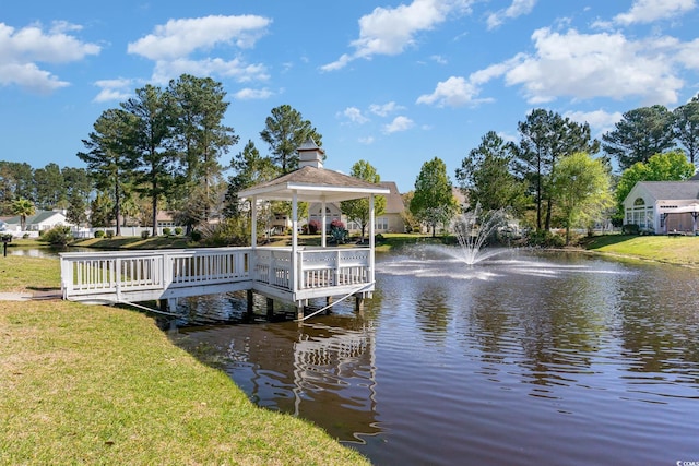 view of dock with a gazebo and a water view