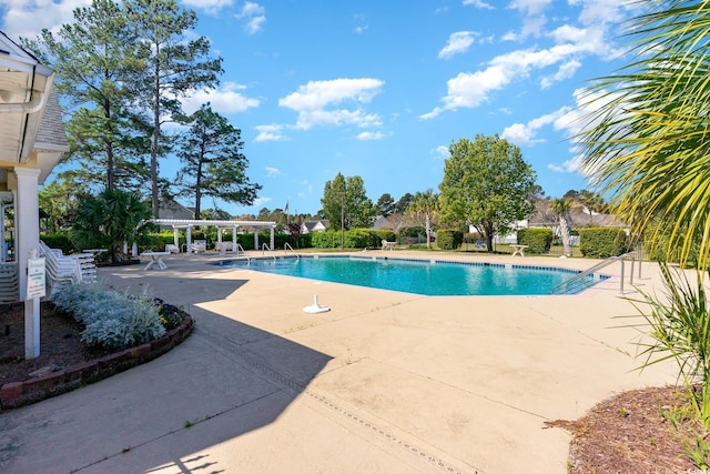 view of swimming pool featuring a patio area