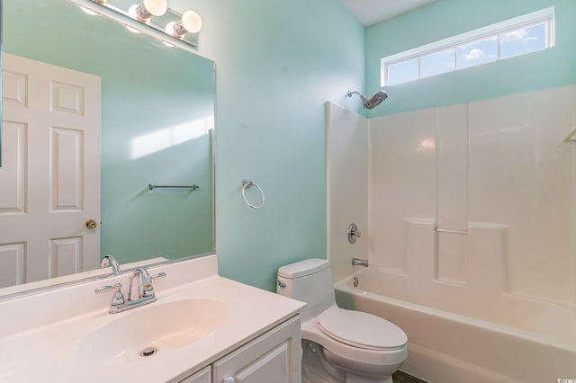 full bathroom featuring bathing tub / shower combination, vanity, and toilet