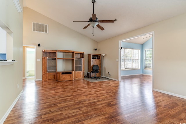 unfurnished living room with hardwood / wood-style floors, high vaulted ceiling, and ceiling fan