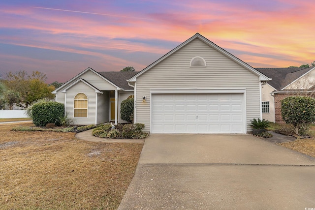 ranch-style house featuring a garage