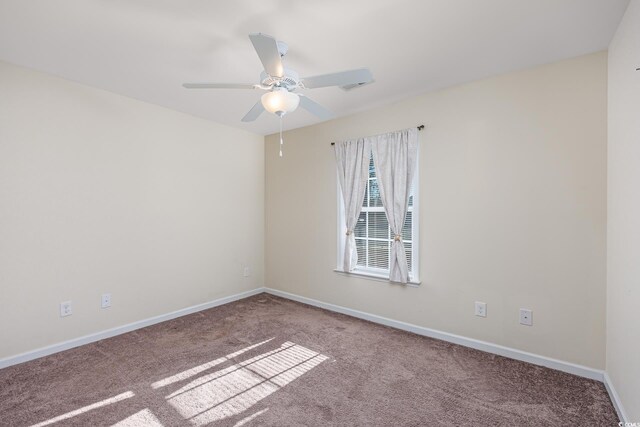 unfurnished room featuring carpet floors and ceiling fan