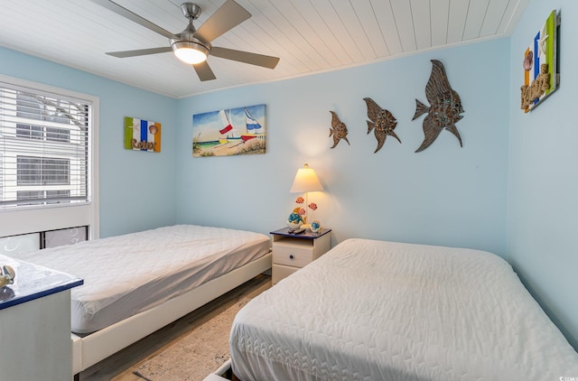 bedroom with hardwood / wood-style flooring, ceiling fan, and wood ceiling