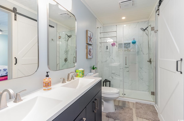 bathroom with toilet, vanity, an enclosed shower, and hardwood / wood-style flooring