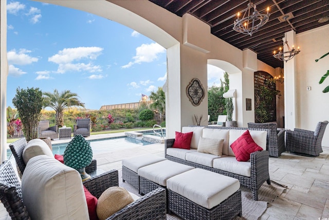 view of patio / terrace with a pool with hot tub