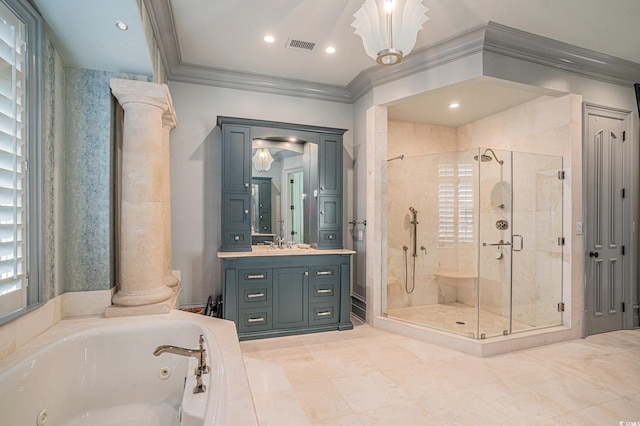 bathroom with separate shower and tub, ornate columns, vanity, and ornamental molding