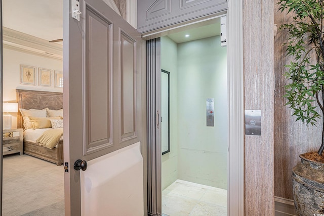 bathroom featuring crown molding and elevator