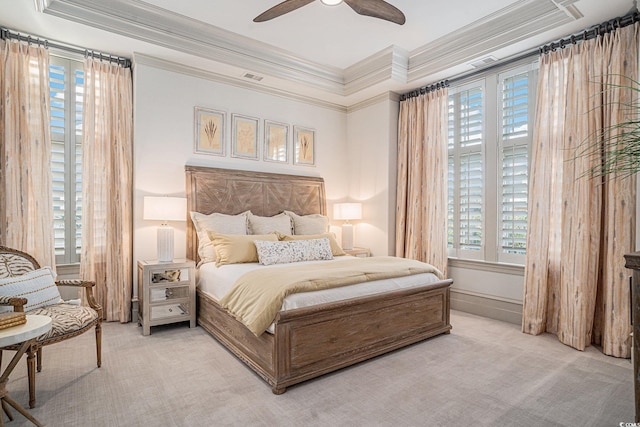 carpeted bedroom featuring ceiling fan and ornamental molding