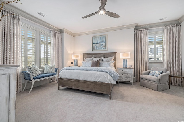 bedroom featuring ceiling fan, light colored carpet, and ornamental molding