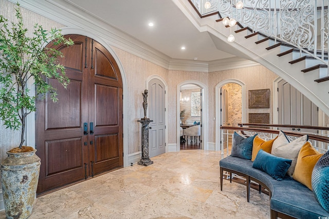 entrance foyer featuring ornamental molding