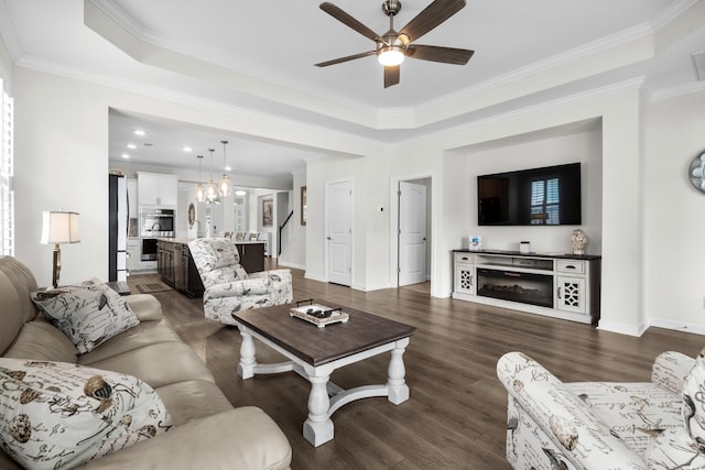 3126 White Jasmine Dr, Little River, SC 29566 - living area with ceiling fan, ornamental molding, dark wood finished floors, a tray ceiling, and recessed lighting