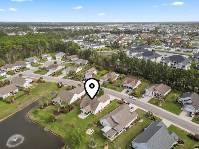 view of property location with nearby suburban area and a large body of water