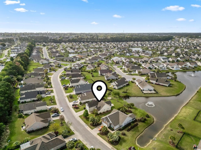 aerial overview of property's location featuring nearby suburban area and a nearby body of water