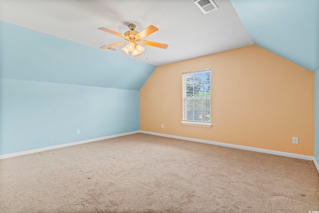 bonus room featuring lofted ceiling, ceiling fan, carpet floors, and baseboards