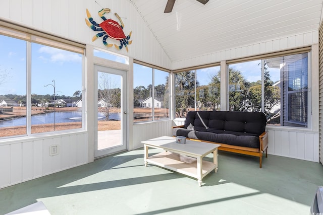 sunroom with lofted ceiling, a water view, a ceiling fan, and an outdoor living space
