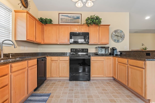 kitchen with black appliances, a sink, a peninsula, dark stone counters, and recessed lighting