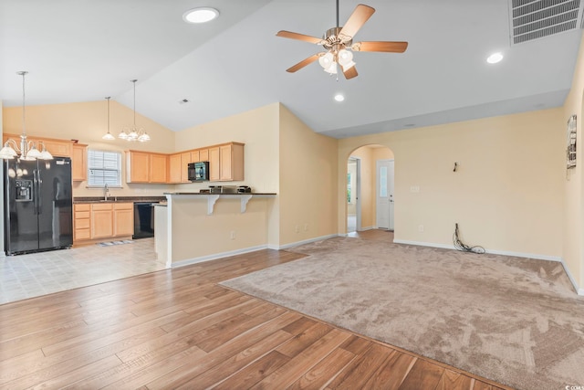 kitchen featuring black appliances, light brown cabinetry, open floor plan, a ceiling fan, and recessed lighting