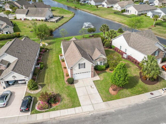 aerial perspective of suburban area with a nearby body of water