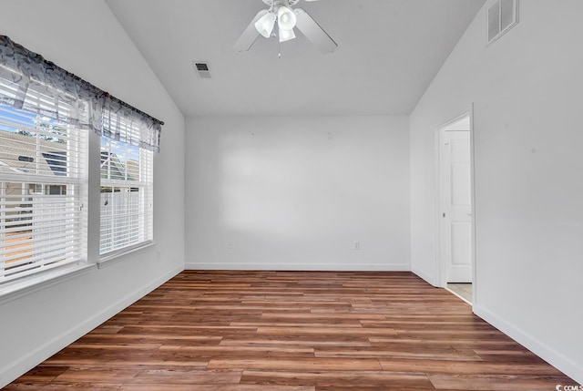 unfurnished room with ceiling fan, hardwood / wood-style floors, and lofted ceiling