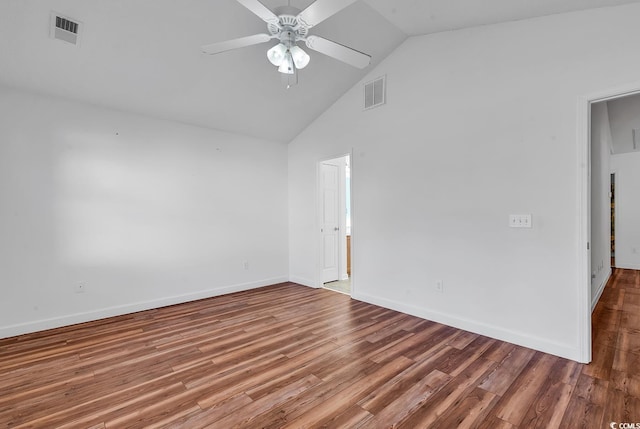 spare room with hardwood / wood-style floors, ceiling fan, and high vaulted ceiling