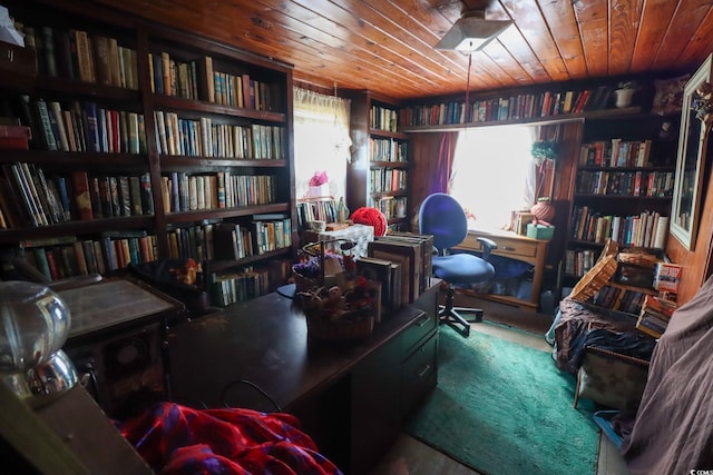 carpeted office featuring wood ceiling