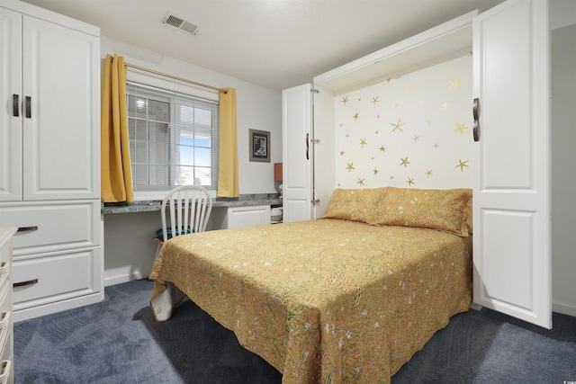 bedroom featuring dark carpet