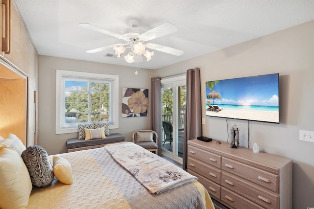 bedroom with ceiling fan and access to outside