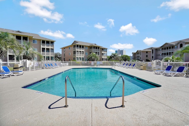 view of swimming pool with a patio