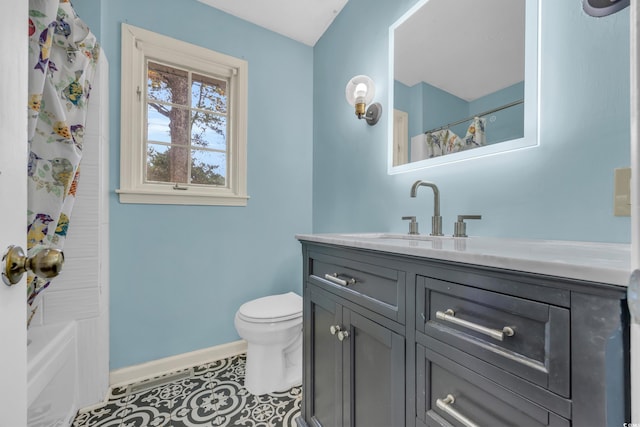 full bathroom with tile patterned flooring, vanity, toilet, and shower / bath combo with shower curtain