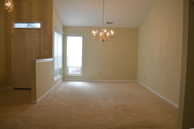 unfurnished dining area with light carpet, vaulted ceiling, and a notable chandelier