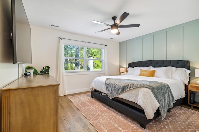 bedroom featuring ceiling fan and hardwood / wood-style flooring