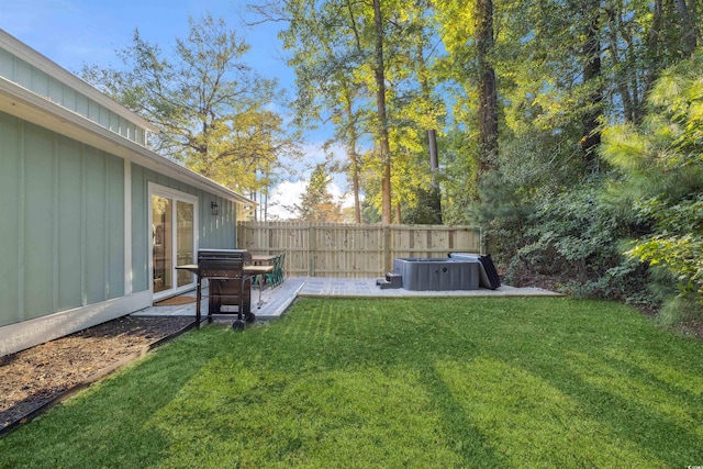 view of yard featuring a patio area and a hot tub