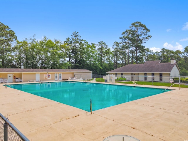 view of swimming pool with a patio area