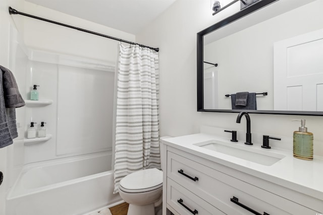 full bathroom with hardwood / wood-style floors, vanity, toilet, and shower / bath combo with shower curtain