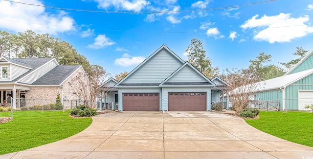 view of front of house with a garage and a front lawn