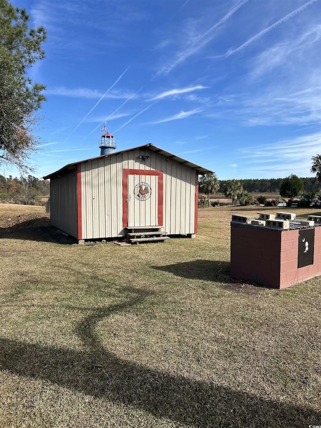 view of outbuilding with a lawn