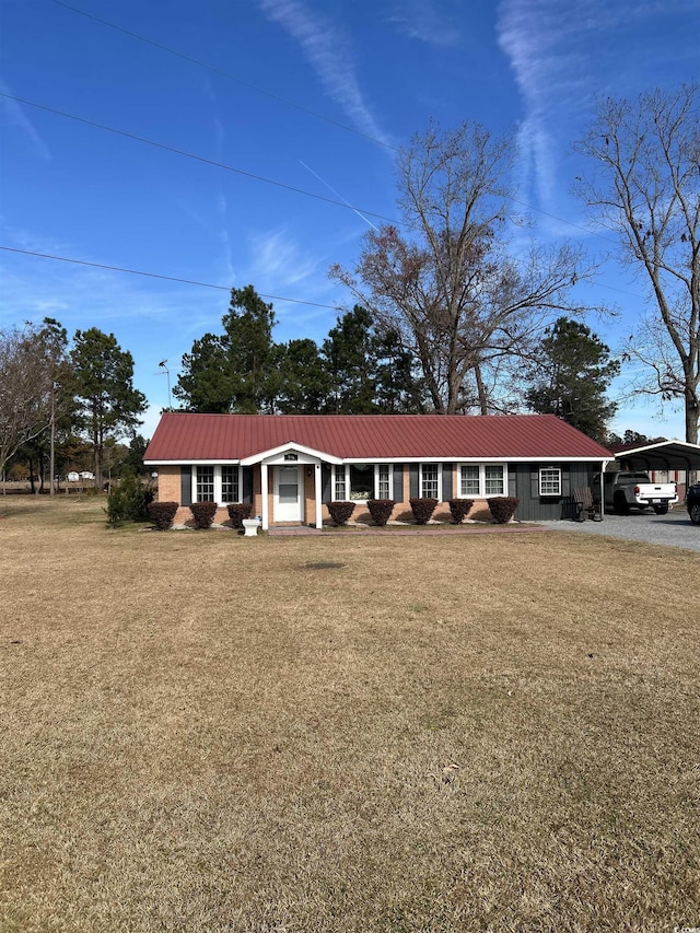 ranch-style home featuring a front yard and a carport