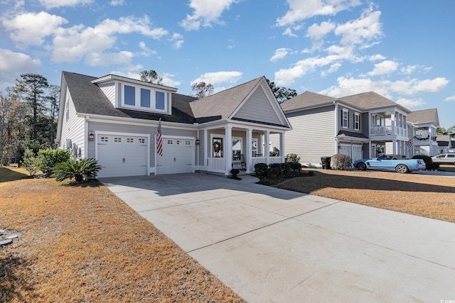 view of front of house featuring a porch and a garage