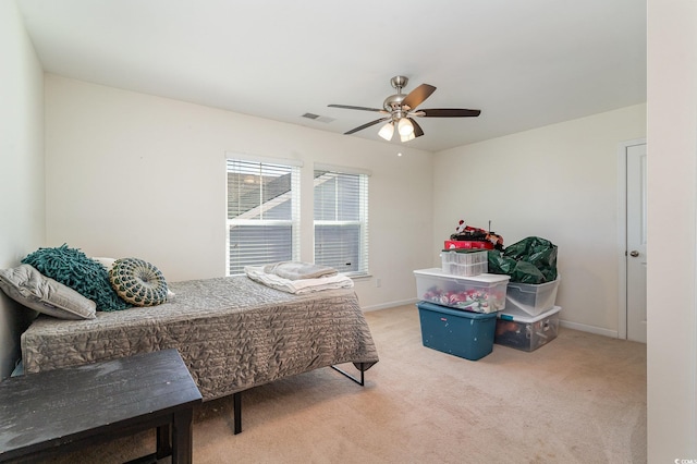 carpeted bedroom featuring ceiling fan