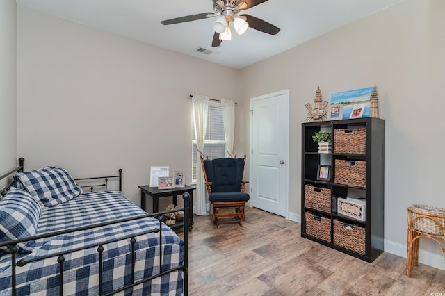 bedroom with ceiling fan and hardwood / wood-style flooring