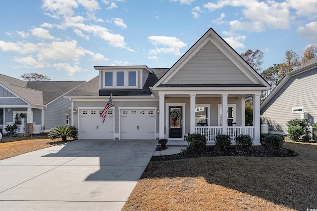 view of front of house with covered porch and a garage