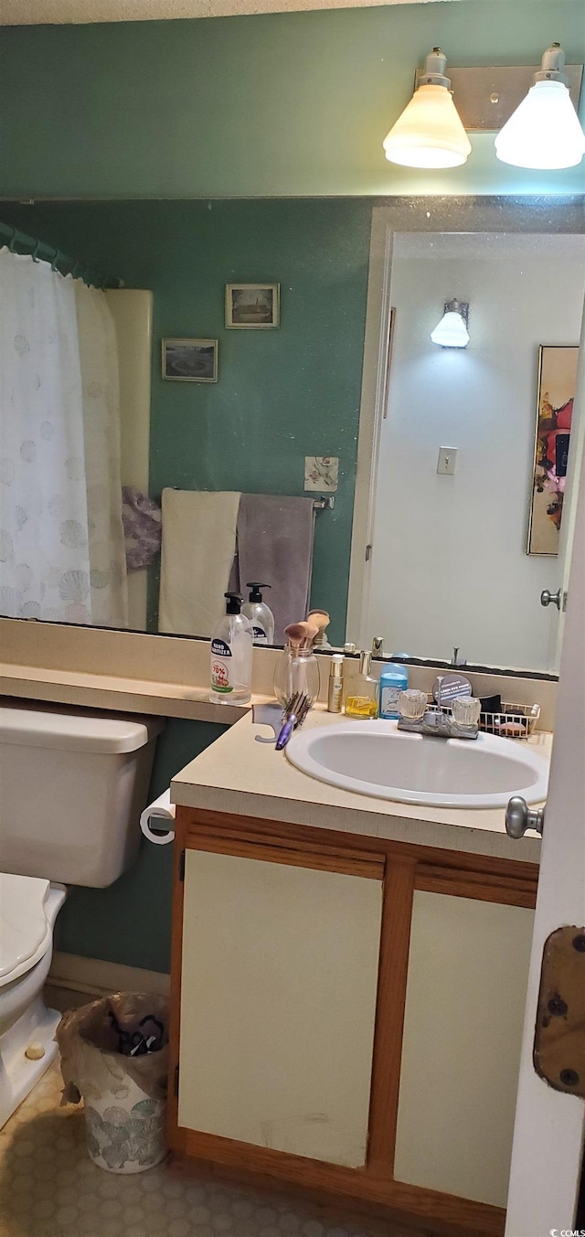 bathroom with vanity and toilet